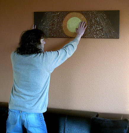 Our blind friend discovering the painting by touching it