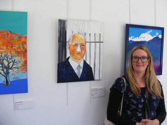 Helen beside her artwork